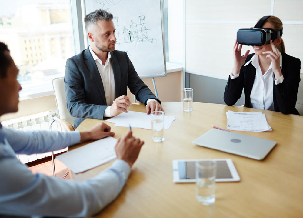 Woman with VR Goggles at Meeting